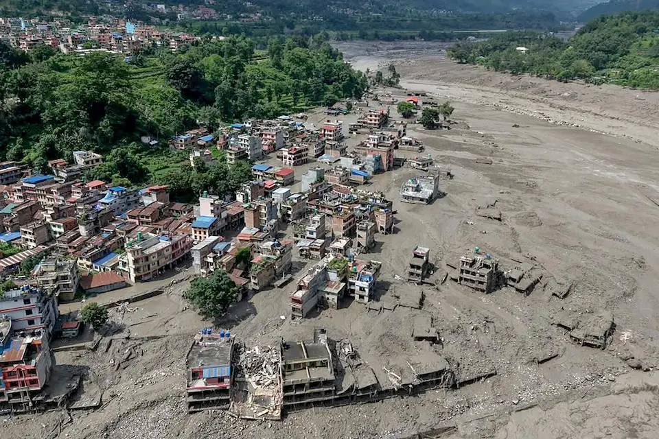 Aerial view of a Nepal town buried in mud and debris after catastrophic flooding